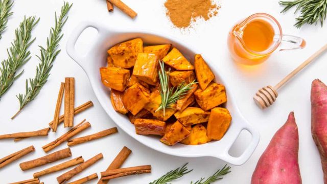 5D4B5901 Honey Cinnamon Roasted Sweet Potatoes plated sweet potatoes on a white table surrounded by cinnamon sweet potatoes honey and rosemary 1200x800 | موسوعة الشرق الأوسط