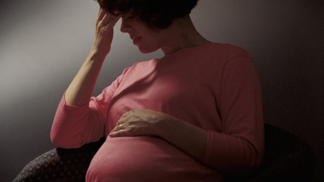 Woman Stress Worry Pregnant Stomach Depressed | موسوعة الشرق الأوسط