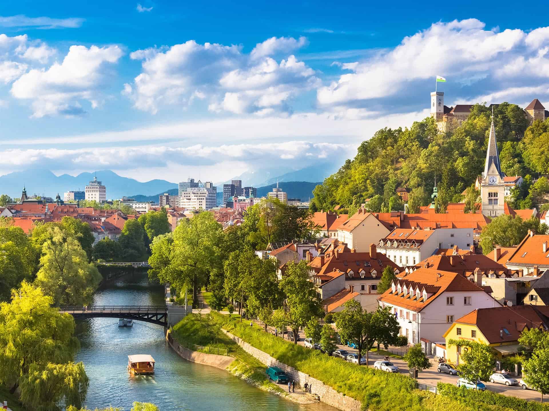 beautiful ljubljana city in slovenia houses river trees mountains clouds 1080P wallpaper | موسوعة الشرق الأوسط