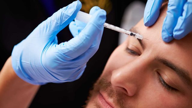 man having botox treatment at beauty clinic | موسوعة الشرق الأوسط