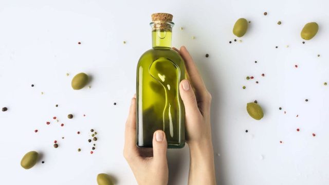 woman holding olive oil 741496747 1200x800 1 | موسوعة الشرق الأوسط